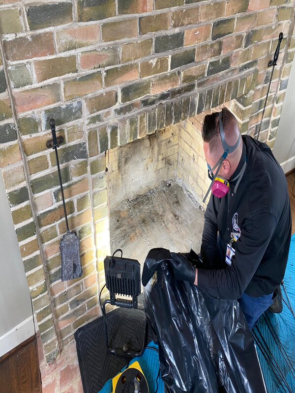 Herriman Chimney Cleaning Service Chimney being cleaned inside a home